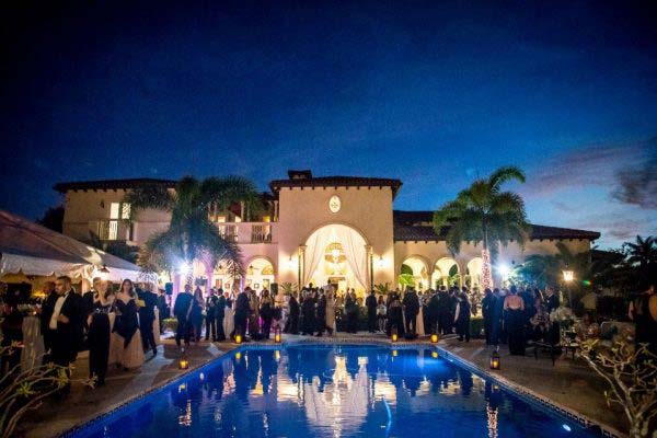 people partying near the pool