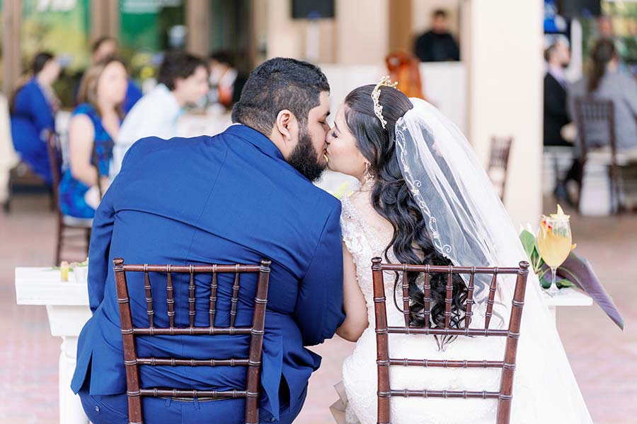 couple kissing on wedding